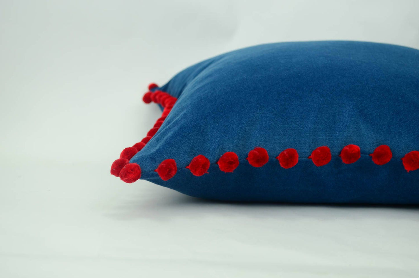 Blue pillow with red pom poms // velvet pom pom pillow // blue and red pom cushion // blue pom poms pillow // red pom poms cushion
