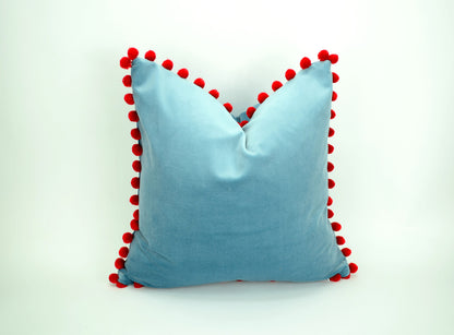 Blue velvet pillow with red pom poms // blue and red pillow // velvet pom pom pillow //  pom pom pillow // pom pom cushion