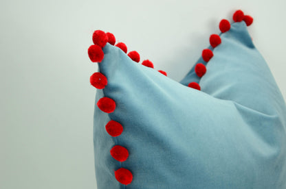 Blue velvet pillow with red pom poms // blue and red pillow // velvet pom pom pillow //  pom pom pillow // pom pom cushion