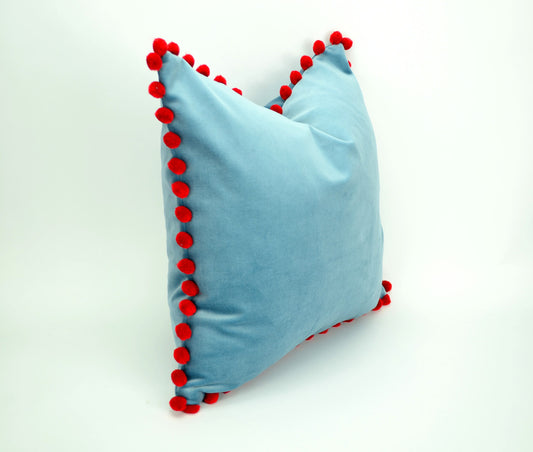 Blue velvet pillow with red pom poms // blue and red pillow // velvet pom pom pillow //  pom pom pillow // pom pom cushion