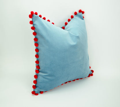 Blue velvet pillow with red pom poms // blue and red pillow // velvet pom pom pillow //  pom pom pillow // pom pom cushion