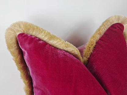 top of a pink cerise silk velvet pillow with gold 